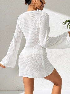 Elegant white crochet beach cover-up dress with deep V-neck and flared long sleeves