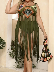 Detail of army green crochet beach cover-up with colorful patterns and long fringes