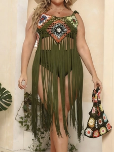 Detail of olive green crochet beach dress featuring colorful geometric patterns and long fringe