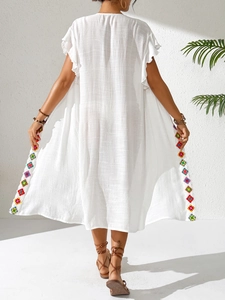 White bohemian beach cover-up with colorful geometric crochet lace and ruffle sleeves