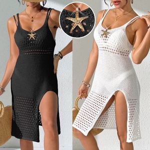 Close-up of golden starfish hardware on crochet knit beach dress with side slit detail