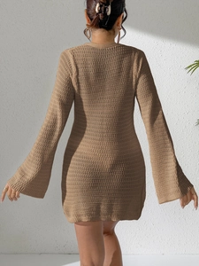 Rear view of brown crochet knit mini dress with flared sleeves and hollow-out texture