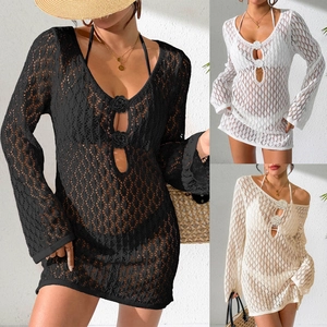 Detail of crochet floral V-neckline and hollow-out texture on bohemian beach cover-up