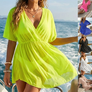 Detail view of deep V-neck mesh beach cover-up with elastic waist and ruffle sleeves