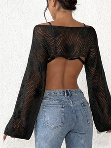 Back view of black crochet beach cover-up with heart pattern and flare sleeves