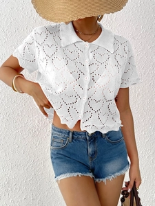 Women's white short sleeve knit cardigan with hollow heart crochet and button front