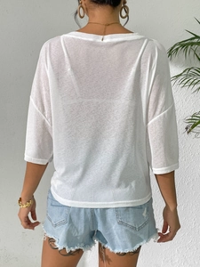 Elegant white semi-transparent off-shoulder beach blouse with loose tie-knot back