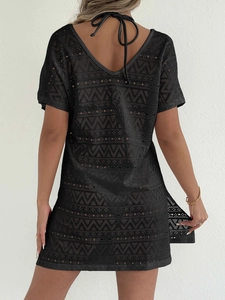 Women's black beach cover-up dress featuring hollow geometric patterns and back tie design