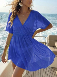 Deep blue sheer mesh beach cover-up featuring a deep V-neck and high-waisted design