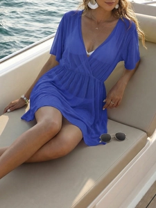 Close-up of deep blue sheer mesh beach cover-up with V-neck and elastic waist