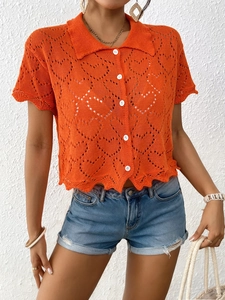 Women's orange knit cardigan with openwork heart pattern and white buttons for summer