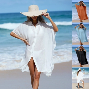 Close-up of lightweight semi-transparent beach cover-up shirt with side slits