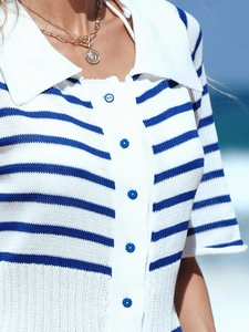 Detail of blue and white striped knit polo dress with white lapel and blue buttons