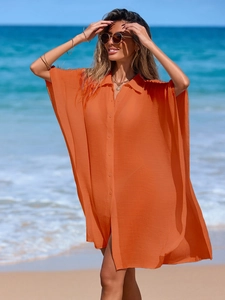 Bright orange beach cover-up shirt with polo collar and sheer oversized short sleeves