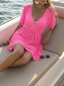 Detail of pink sheer mesh beach cover-up with deep V-neck and high waist on yacht