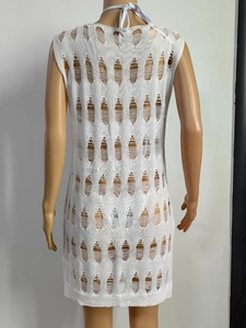 Detailed view of white knit hollow-out beach cover-up dress with halter tie design