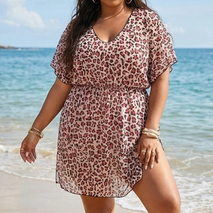 Detailed view of the leopard print mesh beach cover-up with deep V-neck and elastic waist