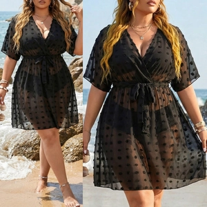 Detail of plus size black Swiss dot chiffon beach cover-up with deep V-neck and waist tie