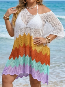 Detailed macro view of the zigzag crochet knit and multicolor wave patterns on beach dress