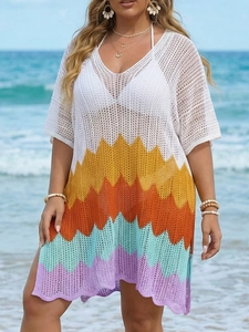Close-up of multicolor crochet texture and wave pattern on hollow beach dress