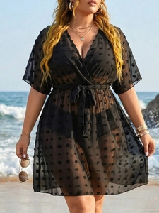 Detail of plus size black chiffon beach cover-up with textured polka dots and waist tie