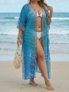 Detail of blue bohemian beach cover-up featuring leopard print and airy chiffon fabric