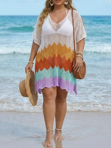 Detail of colorful crochet beach dress with zigzag pattern and openwork knit texture