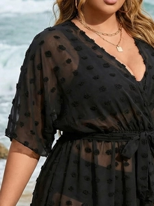 Detail of black Swiss dot chiffon beach cover-up with deep V-neck and adjustable waist tie