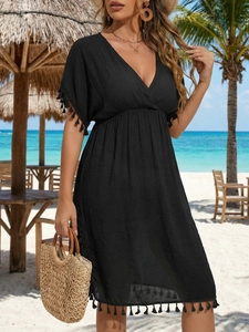 Women's black V-neck beach bikini cover-up dress with tassel trim and pleated waist