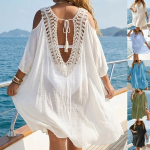 Detail of crochet backless beach dress showing fringe ties and various color options