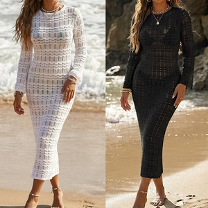 Detail showing white and black hollow-out crochet beach dresses with long sleeves and backless ties