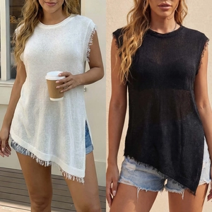 Detail of solid color sleeveless knit top with asymmetrical fringe hem in white and black