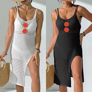 Detail of crochet beach dress showing floral applique and side slit on white and black models