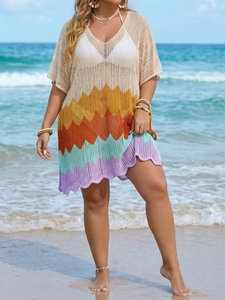 Detail of crochet knit beach dress with colorful wave pattern and hollow out design