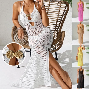 Detail of metallic gold shell buckle on halter crochet knit dress with cutout