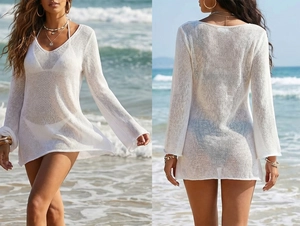 Dettaglio copricostume bianco all'uncinetto con maglia a rete trasparente e scollo a V profondo