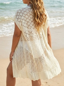 Detailed knit pattern of beige crochet beach cover-up with hollow geometric diamonds