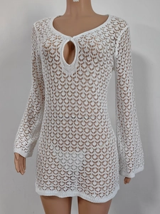 Detail of white hollow crochet knit texture and teardrop neckline on beach cover-up dress