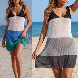 Detail of crochet beach cover-up featuring vibrant stripe patterns and hollow knit texture