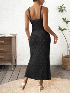 Sexy black open-knit maxi dress with backless design and starfish metal detail