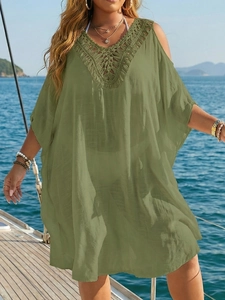 Army green plus size beach cover-up dress with crochet detailing on a yacht deck