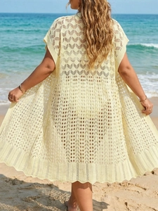 Pale yellow knit crochet beach cover up with geometric hollow patterns and wavy hem