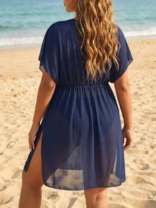 Detail of sheer navy blue mesh beach cover-up featuring high waist and side split hemline