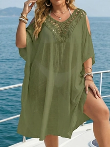 Detail of olive green beach cover-up with crochet lace V-neck and cold shoulder design