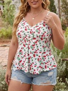 Detail of V-neck cherry print camisole top with ruffled hem and summery floral pattern