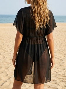 Detail view of sheer mesh beach dress with high waist pleats and seaside vacation vibes