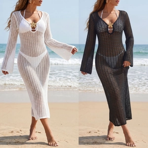 Close-up of the metal starfish detail on a mesh crochet V-neck beach maxi dress cover-up