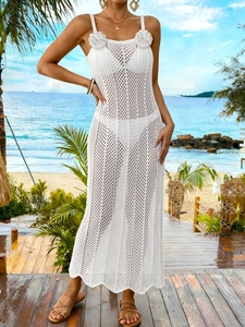 White crochet hollow beach dress with 3D flower accents and elegant wavy hem for summer