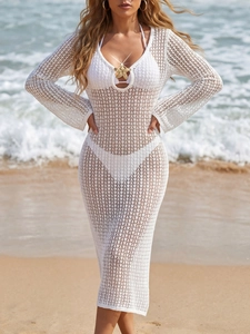 White crochet hollow out V-neck beach maxi dress with metallic starfish detail on beach