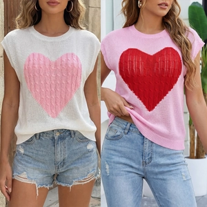 Detail of cable knit texture and large heart pattern on casual sleeveless sweaters